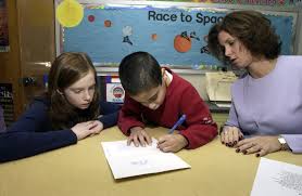 Teacher giving a student a high five.